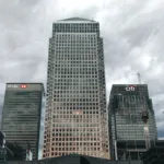 high rise buildings under a cloudy sky