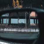 street corner reflecting in rearview mirror
