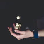 person about to catch four dices