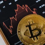 a gold coin on a smartphone screen